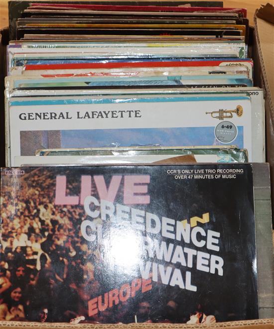 A collection of Lps and 45s including Credence Clearwater Revival, Jonny Cash, Elton John etc.